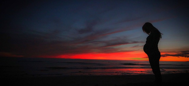 pregnant beach sunset